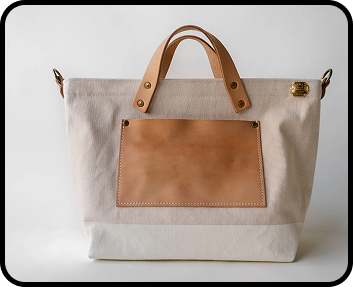 petit-sized superior labor handbag, white canvas with beige leather bottom